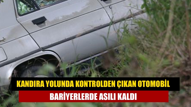 Kandıra yolunda Kontrolden çıkan otomobil bariyerlerde asılı kaldı