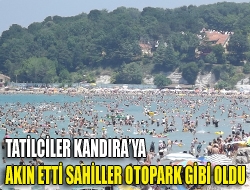 Havaların ısınmasıyla Kandıra Sahillerine akın eden binlerce tatilci plajları tıka